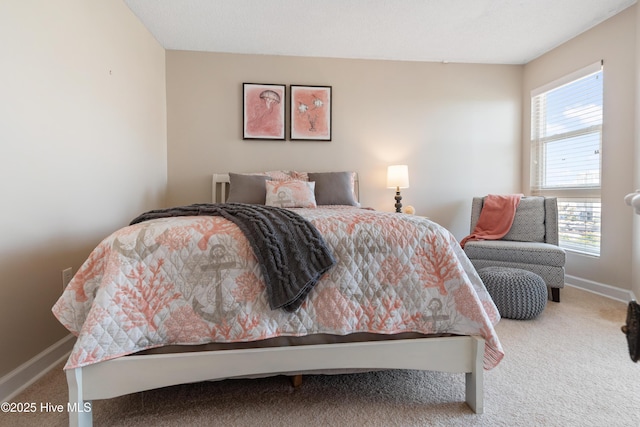 2000 New River Inlet Rd Unit 3113, North Topsail Beach, NC 28460 - carpeted bedroom featuring multiple windows and baseboards