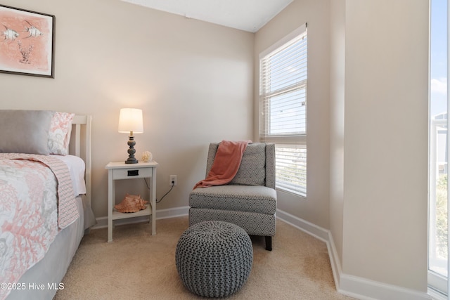 2000 New River Inlet Rd Unit 3113, North Topsail Beach, NC 28460 - bedroom featuring multiple windows, light colored carpet, and baseboards