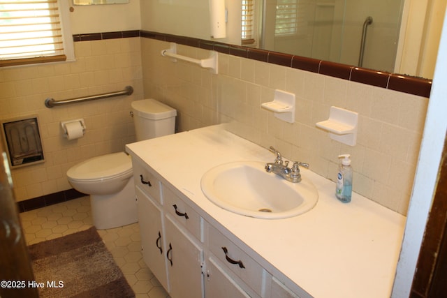 2489 Rodgers School Rd, Williamston, NC 27892 - full bath featuring tile walls, toilet, tile patterned flooring, vanity, and a shower with door