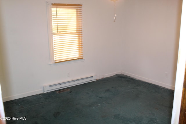 2489 Rodgers School Rd, Williamston, NC 27892 - unfurnished room featuring a baseboard heating unit, plenty of natural light, and baseboards