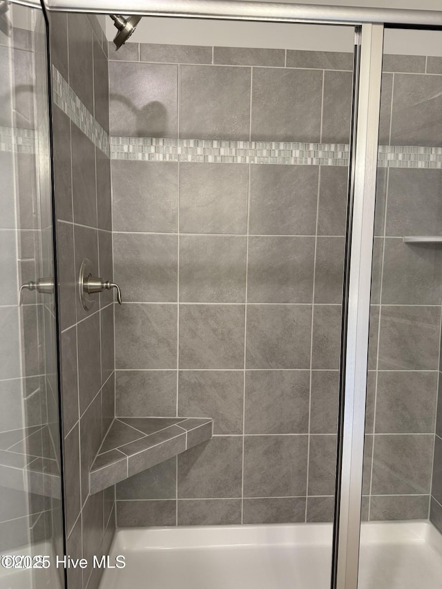 full bath featuring a stall shower