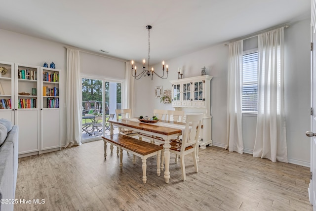 815 Avington Ln NE, Leland, NC 28451 - dining room featuring a chandelier and light wood-type flooring