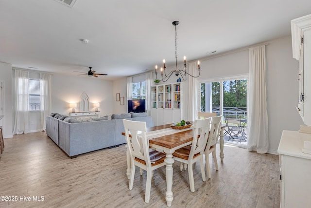 815 Avington Ln NE, Leland, NC 28451 - dining space with light wood-style floors, healthy amount of natural light, a chandelier, and ceiling fan