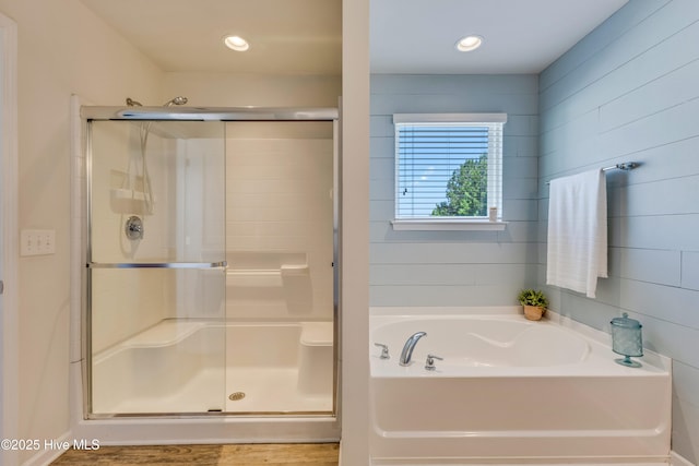 815 Avington Ln NE, Leland, NC 28451 - full bathroom featuring a stall shower, a garden tub, and wood finished floors
