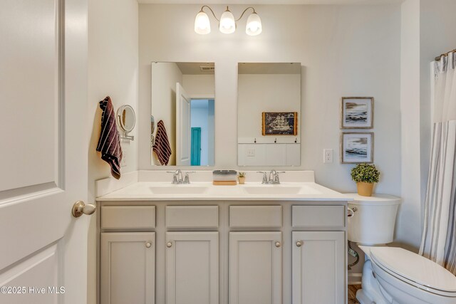 815 Avington Ln NE, Leland, NC 28451 - bathroom with double vanity and toilet
