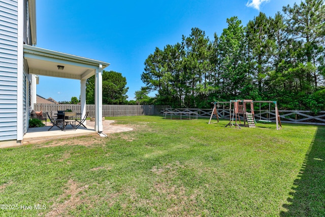 815 Avington Ln NE, Leland, NC 28451 - view of yard featuring a patio and a playground