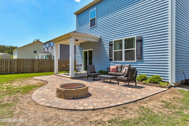 815 Avington Ln NE, Leland, NC 28451 - view of patio featuring an outdoor living space with a fire pit