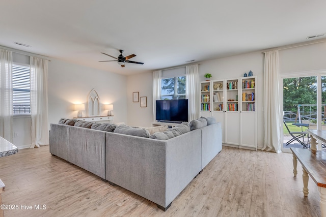 815 Avington Ln NE, Leland, NC 28451 - living area with light wood-style floors and a ceiling fan