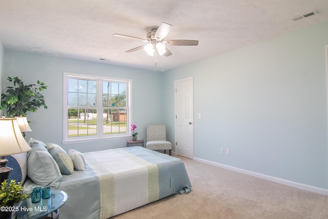 1 Willetts Dr, Southport, NC 28461 - bedroom with light colored carpet and a ceiling fan