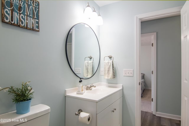 1 Willetts Dr, Southport, NC 28461 - bathroom featuring wood finished floors, vanity, and ensuite bath