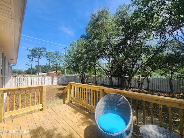 1 Willetts Dr, Southport, NC 28461 - wooden deck with a fenced backyard