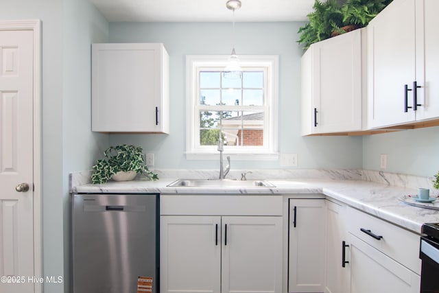 1 Willetts Dr, Southport, NC 28461 - kitchen featuring dishwasher, white cabinetry, light countertops, and pendant lighting