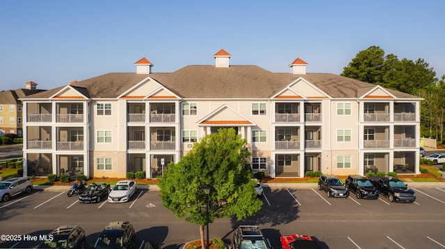 395 S Crow Creek Dr Unit 1601, Calabash, NC 28467 - view of building exterior featuring uncovered parking