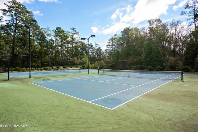 395 S Crow Creek Dr Unit 1601, Calabash, NC 28467 - view of tennis court featuring fence and community basketball court