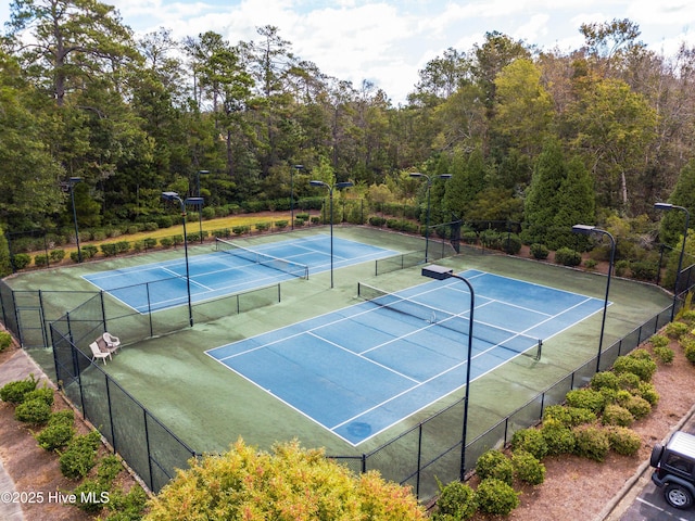 395 S Crow Creek Dr Unit 1601, Calabash, NC 28467 - view of tennis court featuring fence and a wooded view