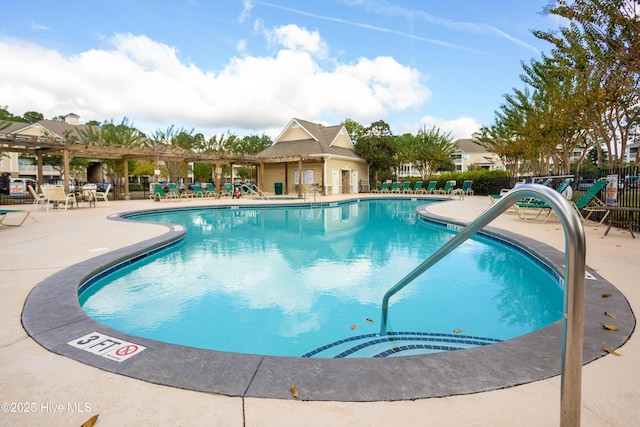 395 S Crow Creek Dr Unit 1601, Calabash, NC 28467 - community pool featuring a pergola, a patio area, and fence