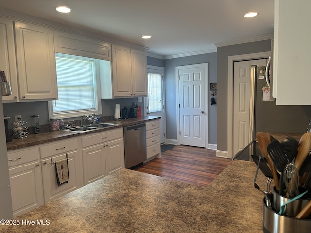 kitchen featuring dishwasher, dark countertops, dark wood-style floors, a sink, and ornamental molding