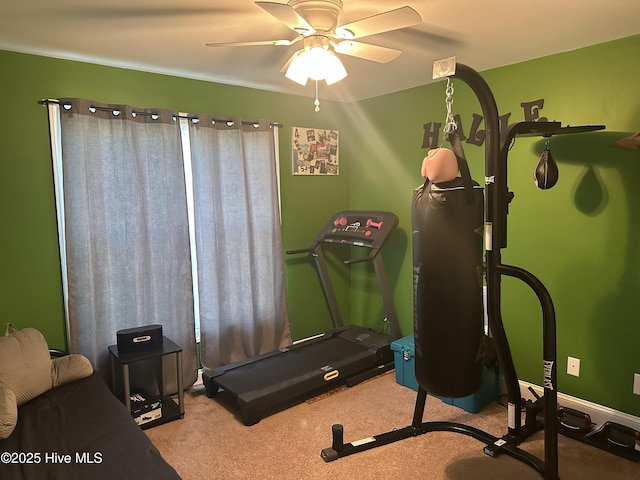 workout room with carpet flooring and a ceiling fan