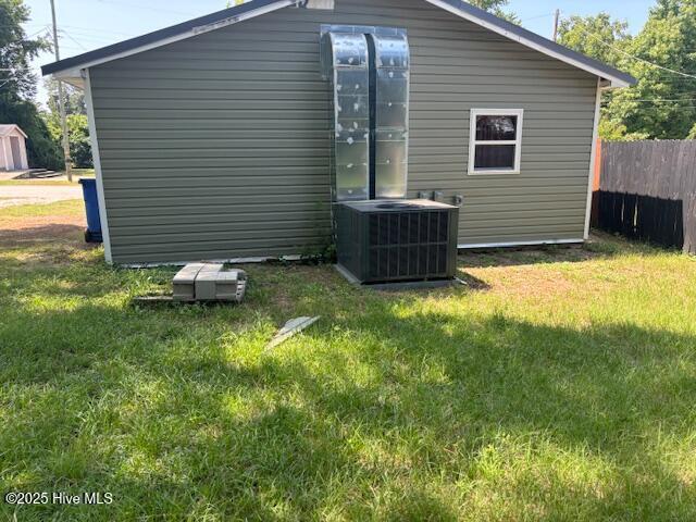 5106 Hodge St, Fayetteville, NC 28303 - view of side of property featuring central air condition unit and an outbuilding