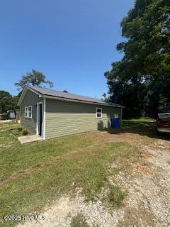 5106 Hodge St, Fayetteville, NC 28303 - view of home's exterior with a lawn