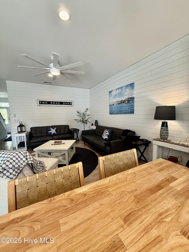 264 Great Egret Way, Beaufort, NC 28516 - dining area featuring a ceiling fan and wood walls