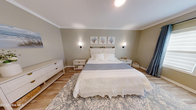 264 Great Egret Way, Beaufort, NC 28516 - bedroom featuring light wood-type flooring, baseboards, and ornamental molding