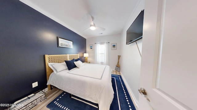 264 Great Egret Way, Beaufort, NC 28516 - bedroom with baseboards, wood finished floors, and ceiling fan