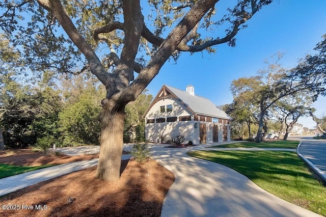 264 Great Egret Way, Beaufort, NC 28516 - rustic home featuring a chimney, a garage, and a front lawn