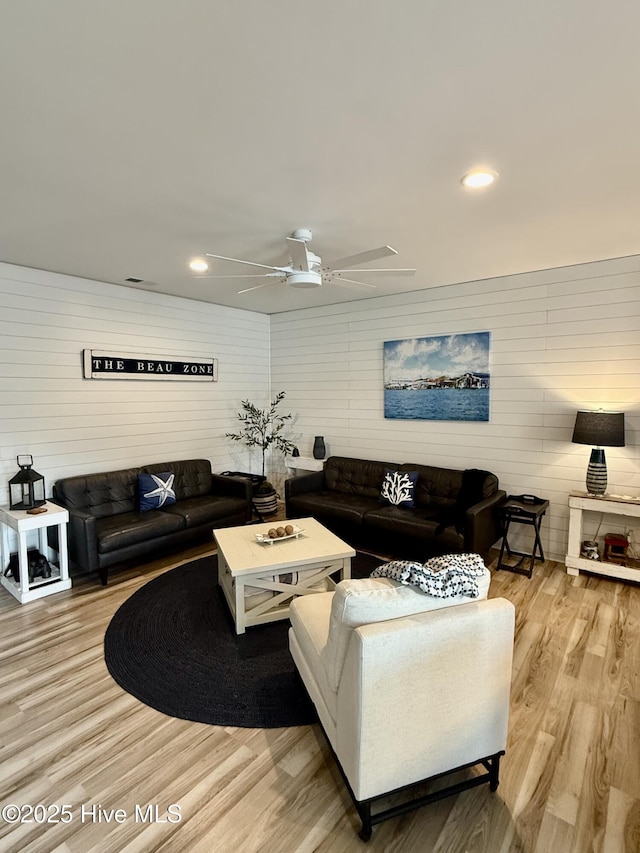 264 Great Egret Way, Beaufort, NC 28516 - living room featuring wood finished floors, ceiling fan, wooden walls, and recessed lighting