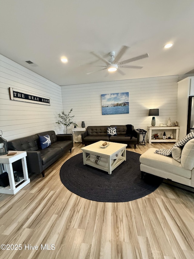 264 Great Egret Way, Beaufort, NC 28516 - living area with a ceiling fan, light wood finished floors, recessed lighting, and wood walls