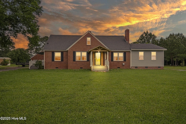 1047 US Highway 158 W, Gates, NC 27937 - view of front of house with crawl space, a yard, a chimney, and brick siding