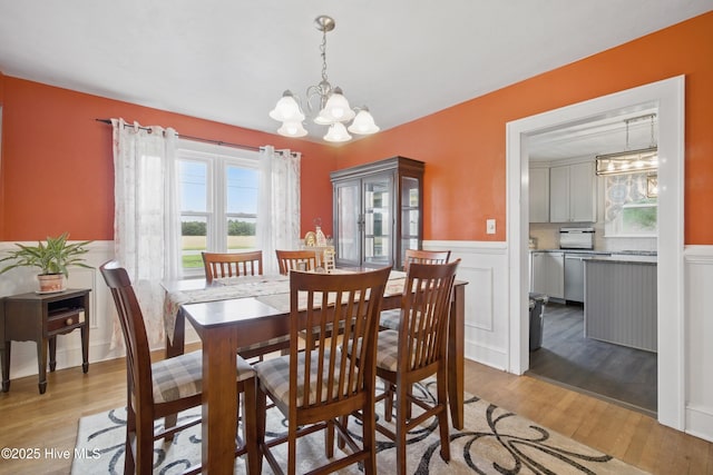1047 US Highway 158 W, Gates, NC 27937 - dining room featuring a chandelier, light wood-style floors, and wainscoting