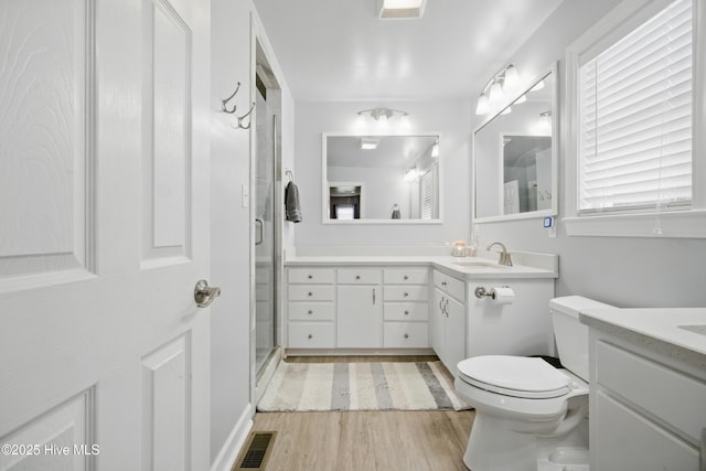 1047 US Highway 158 W, Gates, NC 27937 - full bathroom with toilet, a stall shower, vanity, and wood finished floors