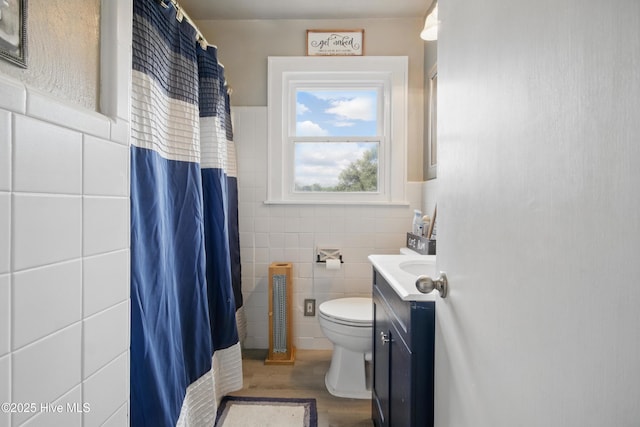 1047 US Highway 158 W, Gates, NC 27937 - bathroom with tile walls, toilet, vanity, wood finished floors, and a shower with curtain