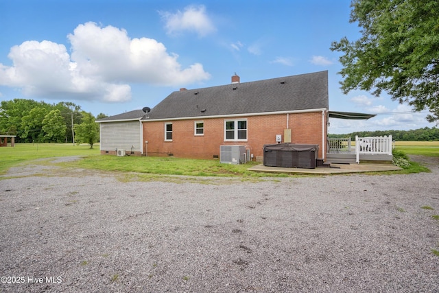 1047 US Highway 158 W, Gates, NC 27937 - rear view of property featuring a hot tub, brick siding, a chimney, and crawl space