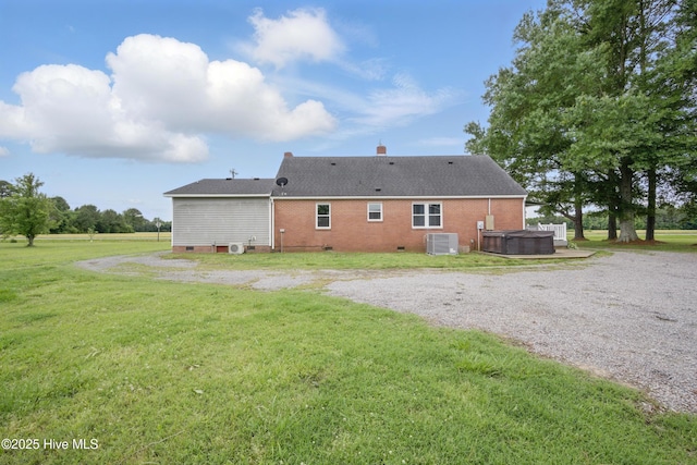 1047 US Highway 158 W, Gates, NC 27937 - back of property with a hot tub, crawl space, a yard, and central AC