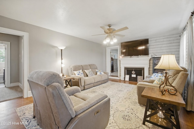 1047 US Highway 158 W, Gates, NC 27937 - living room with ceiling fan, wood finished floors, baseboards, and a fireplace