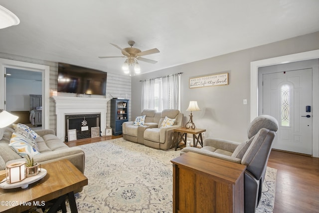 1047 US Highway 158 W, Gates, NC 27937 - living room featuring ceiling fan, wood finished floors, and a fireplace