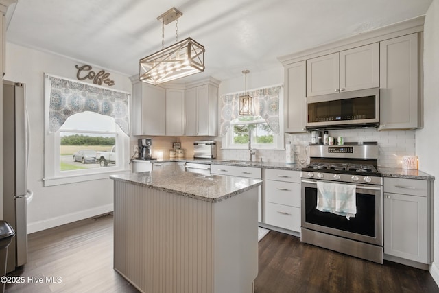 1047 US Highway 158 W, Gates, NC 27937 - kitchen featuring stainless steel appliances, backsplash, dark wood-type flooring, and light stone counters