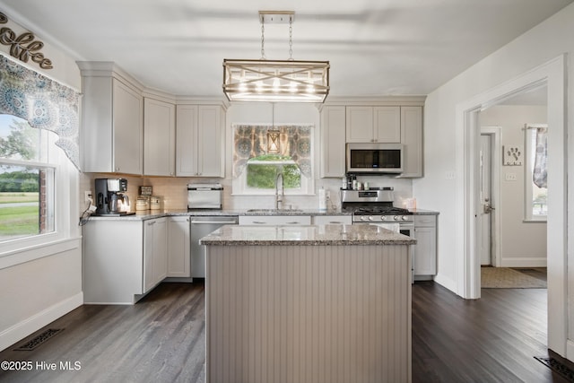 1047 US Highway 158 W, Gates, NC 27937 - kitchen featuring stainless steel appliances, a sink, dark wood finished floors, and light stone counters