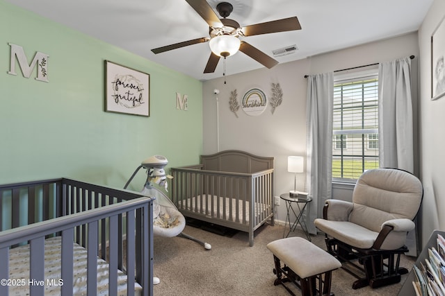 112 Silver Queen Ln, Richlands, NC 28574 - bedroom with carpet, ceiling fan, and a nursery area