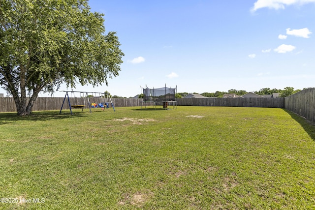 112 Silver Queen Ln, Richlands, NC 28574 - view of yard featuring a trampoline and a playground