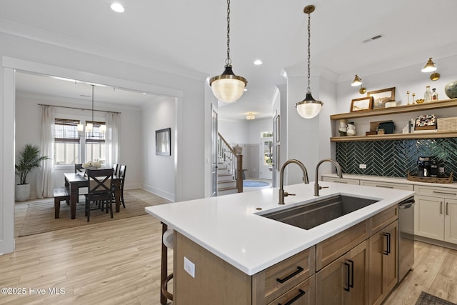 510 White Picket Way, Holly Ridge, NC 28445 - kitchen with a sink, ornamental molding, backsplash, open shelves, and light countertops