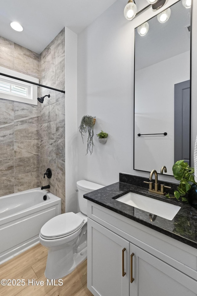 510 White Picket Way, Holly Ridge, NC 28445 - bathroom featuring vanity, toilet, shower / bathtub combination, and wood finished floors