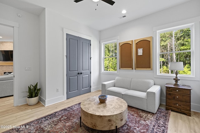 510 White Picket Way, Holly Ridge, NC 28445 - living area with ceiling fan, wood finished floors, and baseboards