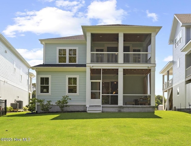 510 White Picket Way, Holly Ridge, NC 28445 - back of house featuring a sunroom, a yard, cooling unit, and entry steps