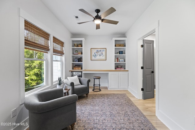 510 White Picket Way, Holly Ridge, NC 28445 - living area with light wood-style floors, ceiling fan, a desk, and baseboards