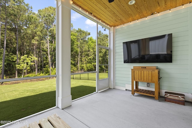 510 White Picket Way, Holly Ridge, NC 28445 - unfurnished sunroom featuring view of scattered trees
