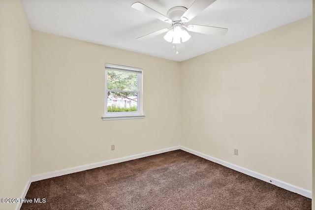 326 Spartan Rd, Wilmington, NC 28405 - spare room with dark colored carpet, baseboards, and ceiling fan