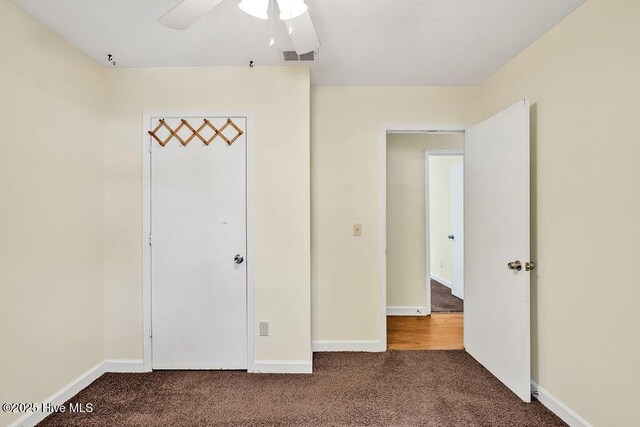 326 Spartan Rd, Wilmington, NC 28405 - unfurnished bedroom with carpet flooring, baseboards, and a ceiling fan